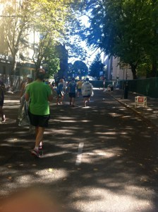 The Finisher Chute is two blocks with only runners and volunteers. It's peaceful and quiet but the end of the race is anticlimatic. We turn a corner, there's no more spectators, and we finish the race in silence. No Chariots of Fire music here