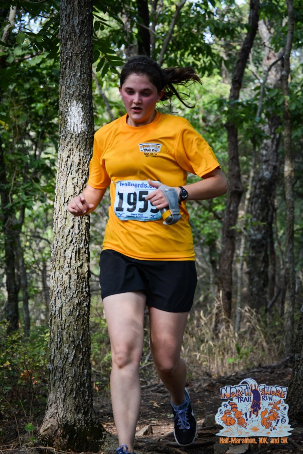 I don't know who she is, but she's doing a lovely job modeling good running form and the official race shirt. It had the cool race logo (in the bottom right corner) on the back.