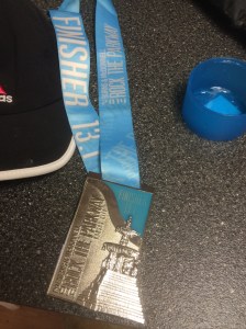 "Cuz I walk with a limp like an ol' school pimp, a real OG" Wait, not really. It's because we just finished a half marathon and are hobbling around with these giant finisher medals around our necks. This thing is wider but slightly shorter than my iPhone 5.