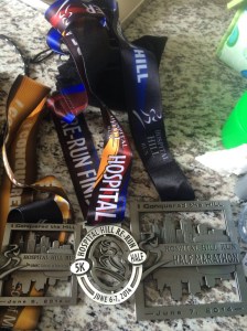 1 medal, 2 medal, 3 medal, ah, ah, ah... The Count would be proud of the race swag we racked up!